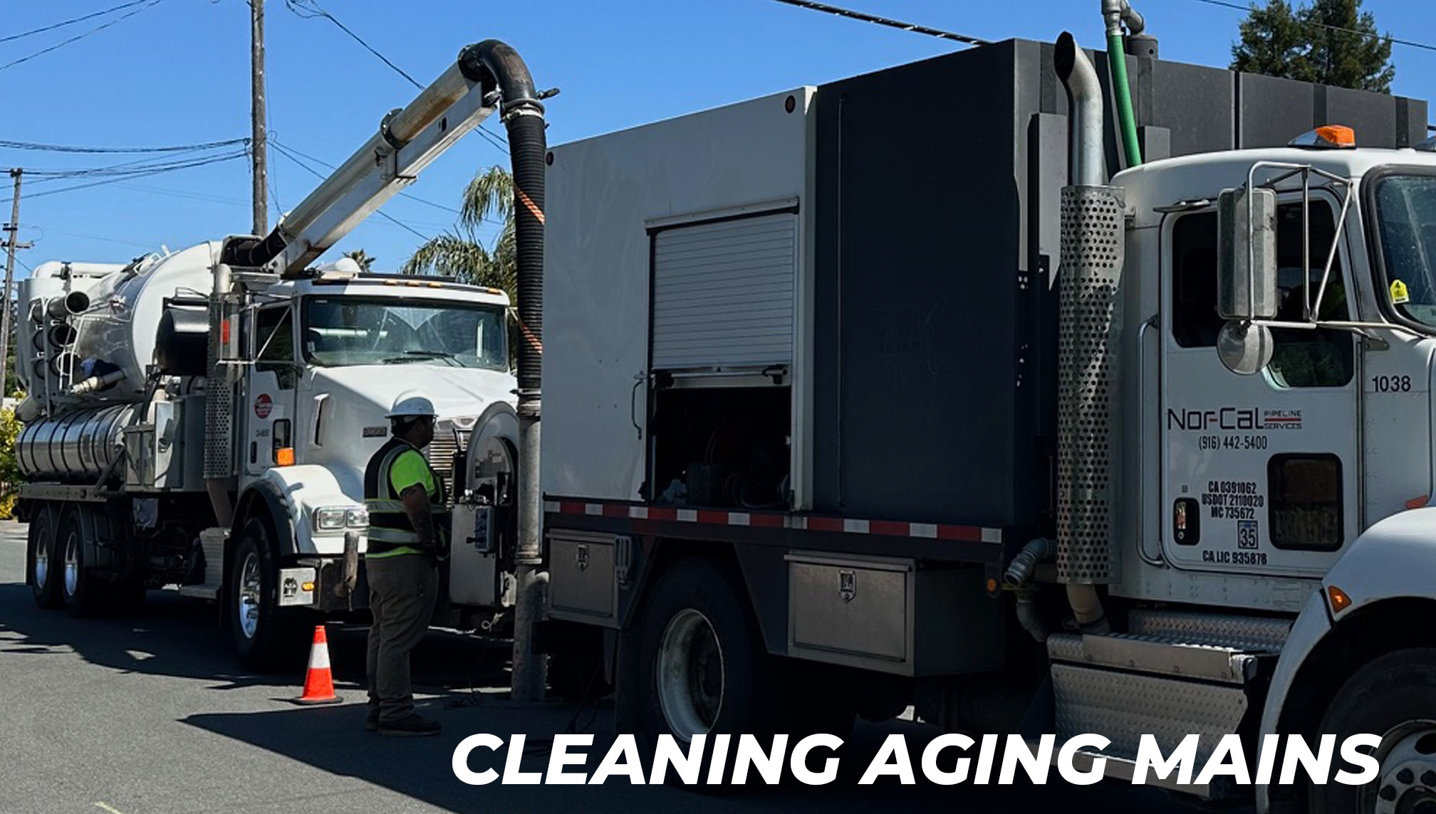Truck from Nor-Cal Pipeline Services cleaning aging sewer mains with technician in safety gear, residential street setting, project related to Rohnert Park sewer rehabilitation.