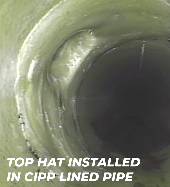 Top hat connection installed in CIPP lined pipe, showcasing trenchless rehabilitation technique for sewer infrastructure.