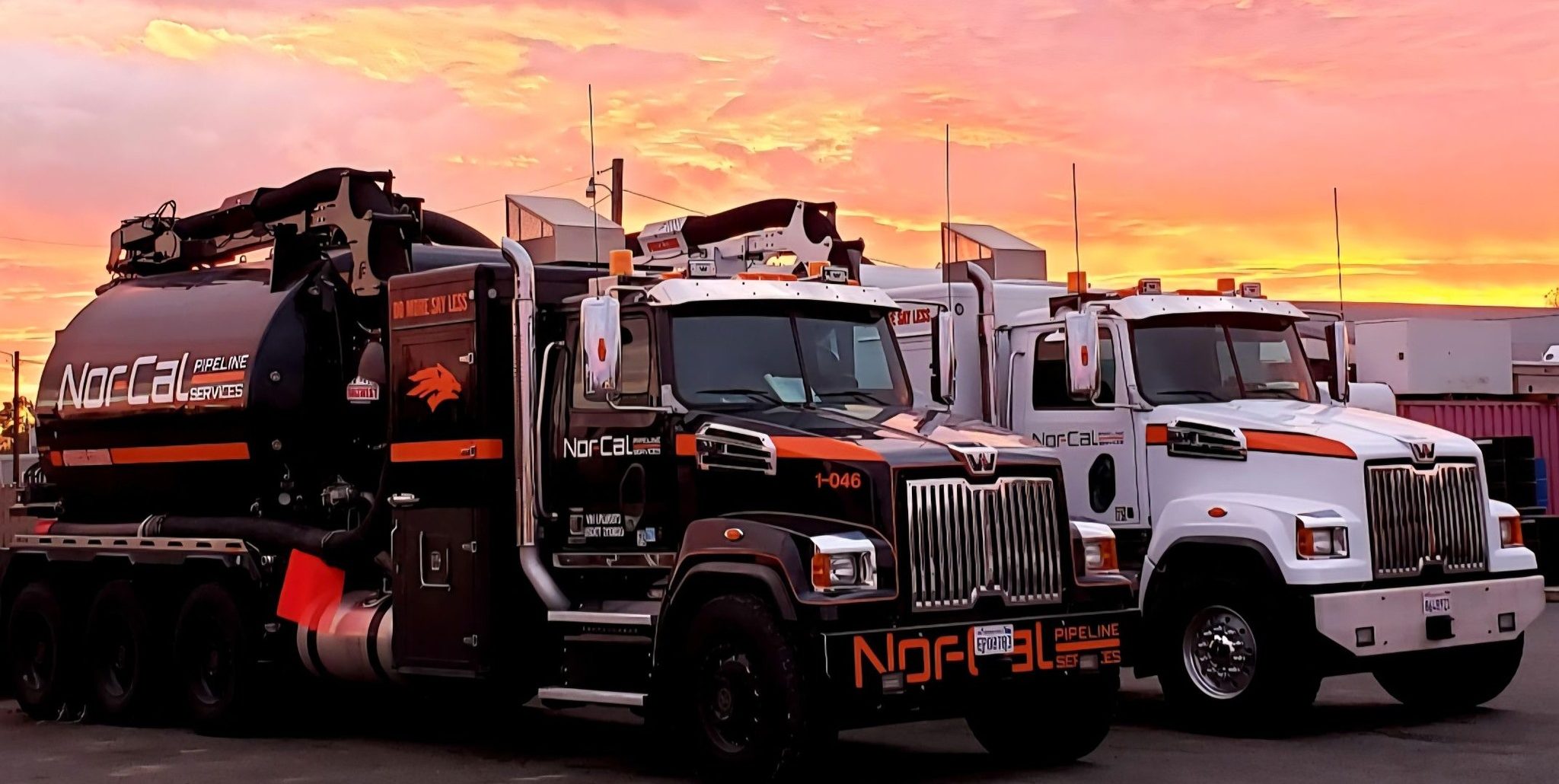 527632177_24262347280050827_452728960065289662_n Nor-Cal Pipeline Services trucks parked under a colorful sunset, showcasing their fleet for underground utility and sewer maintenance services.